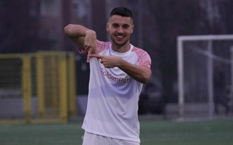 Massimiliano Rossi in maglia arancione